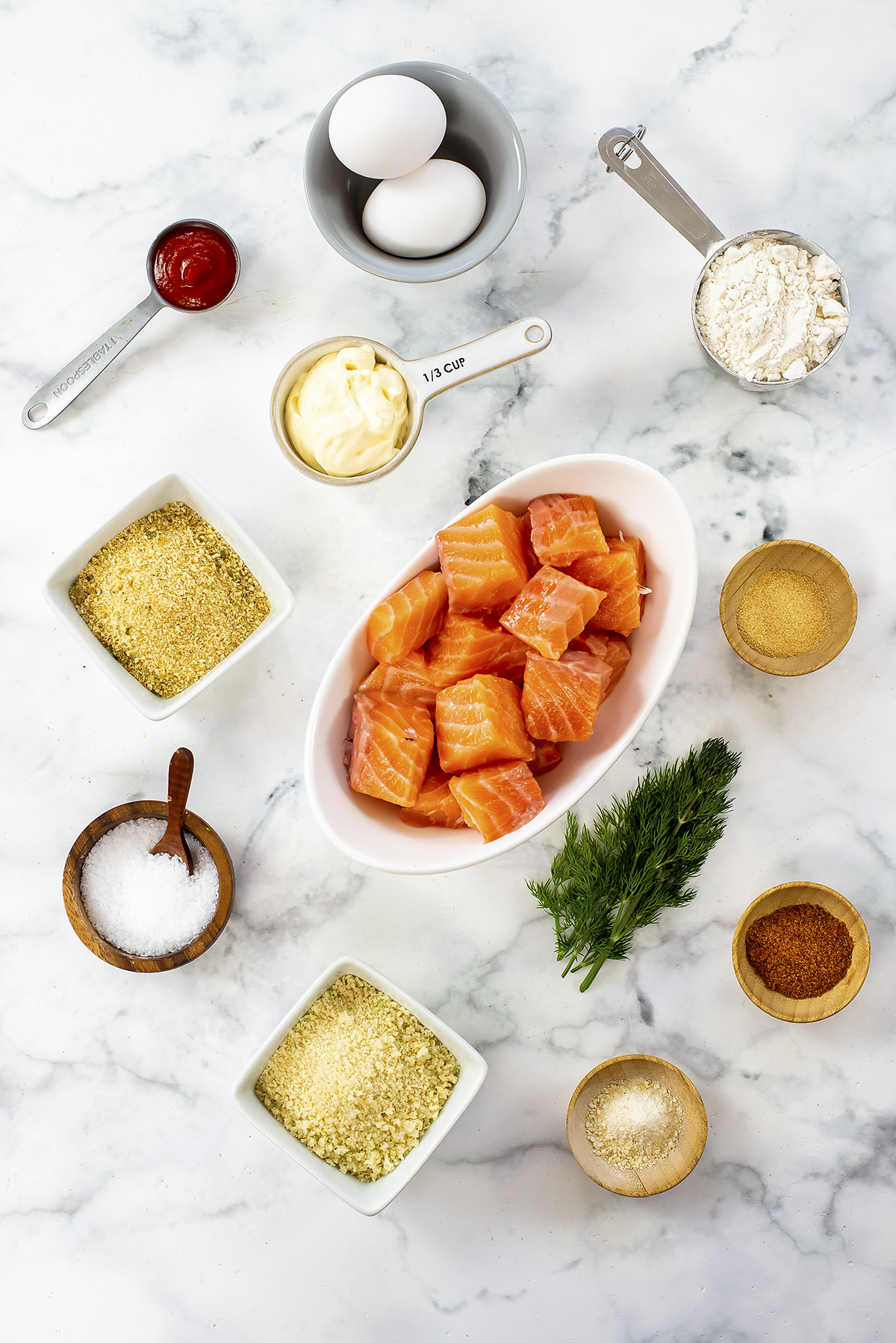 Salmon nugget ingredients on a white countertop.