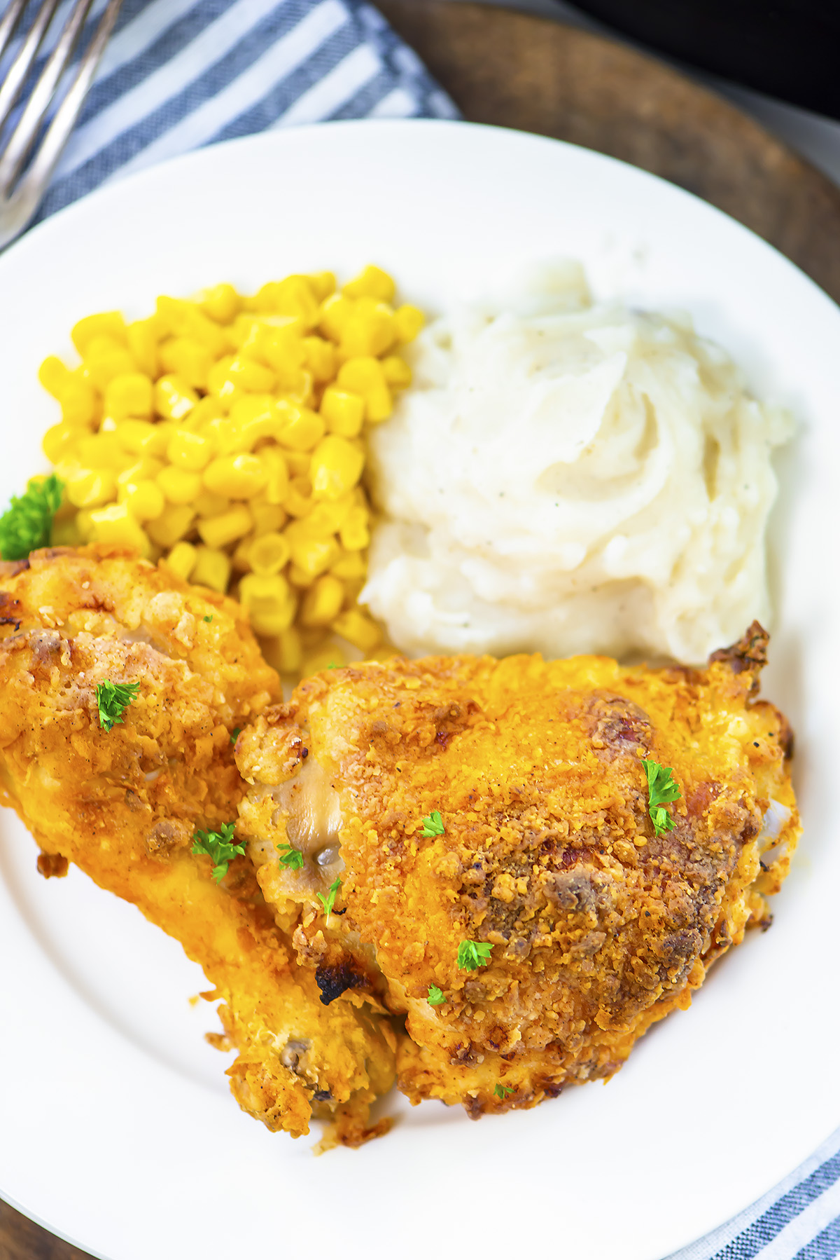 Chicken dinner on a plate.