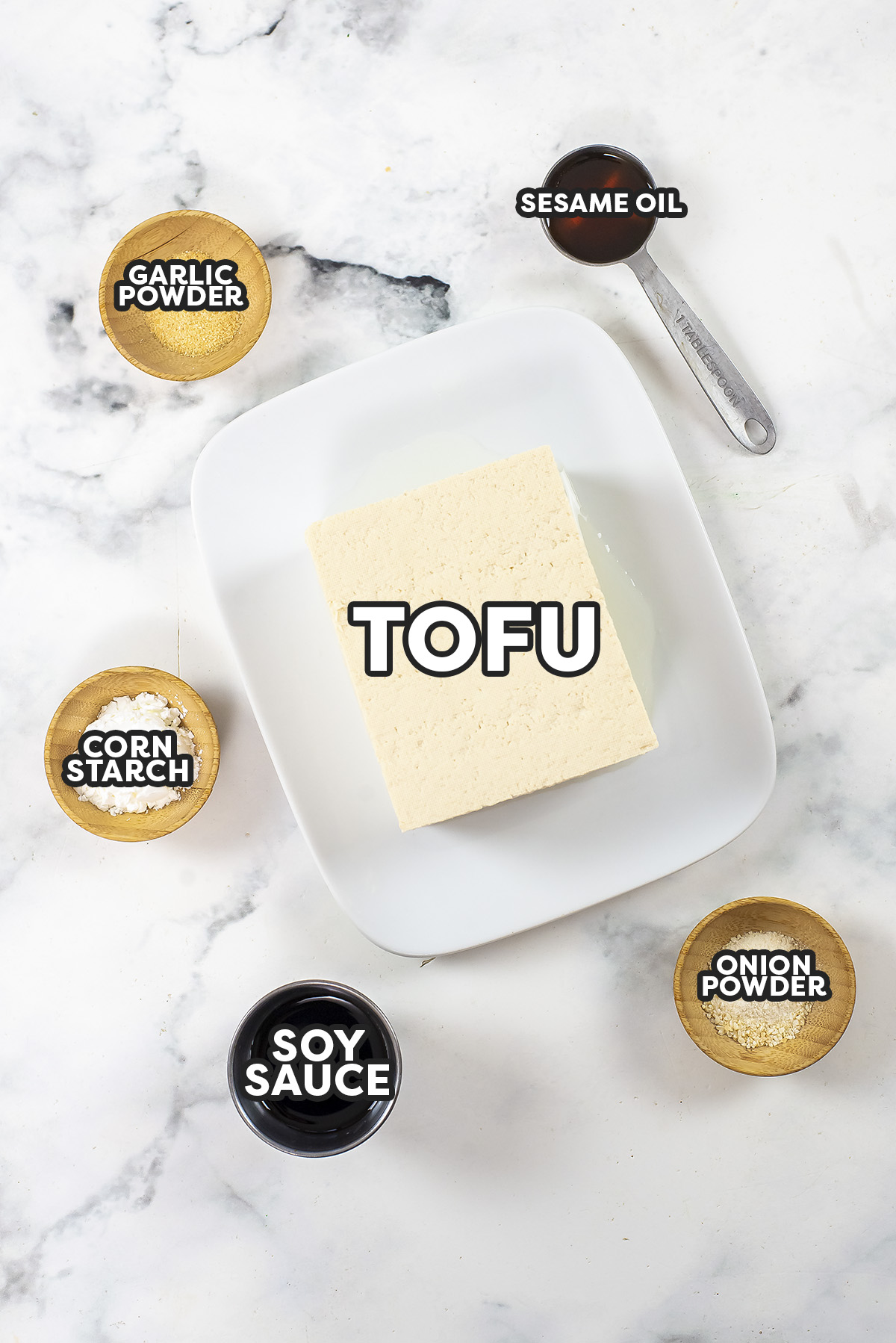 Ingredients for crispy tofu spread on a countertop.