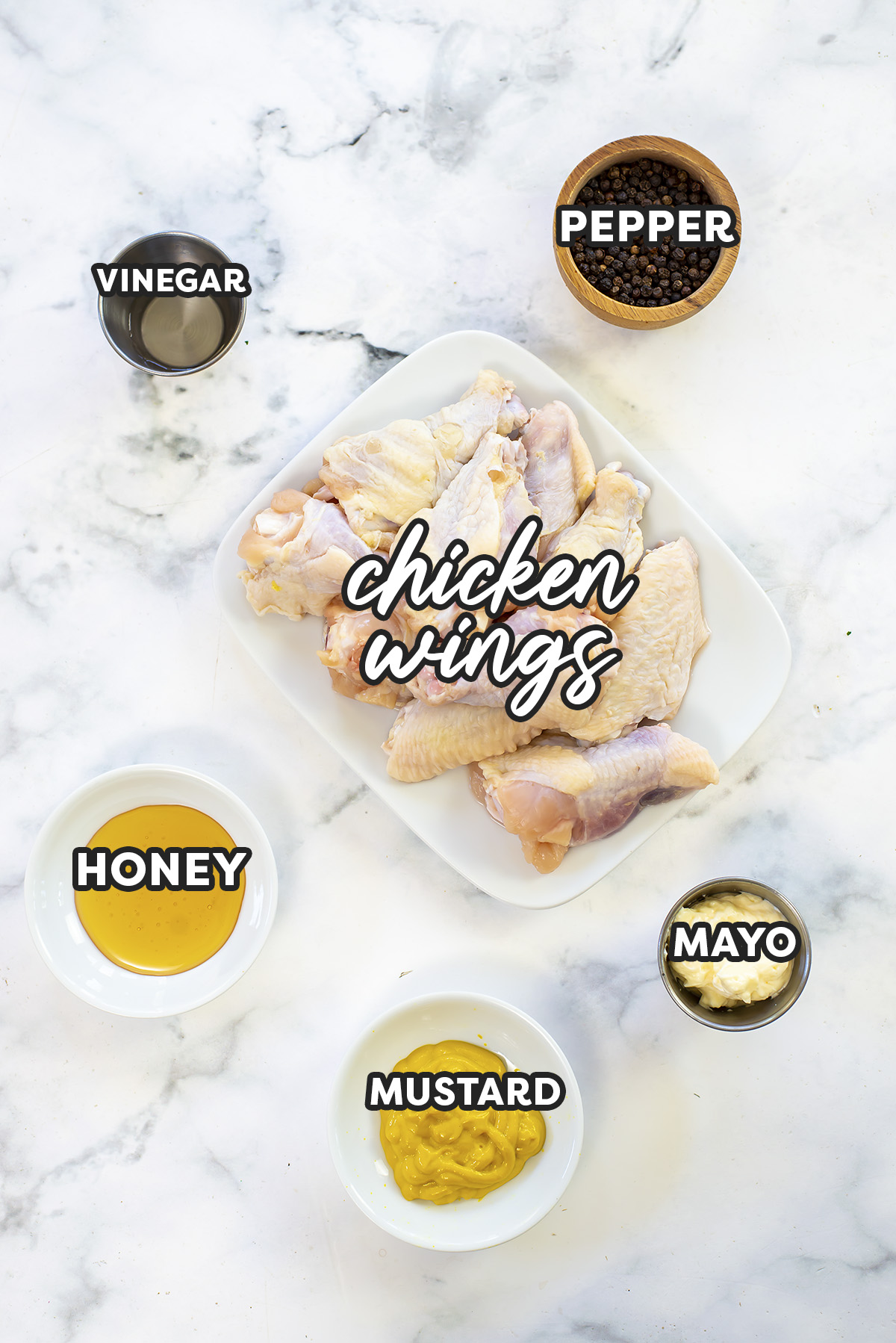 Honey mustard wing ingredients on a white countertop.