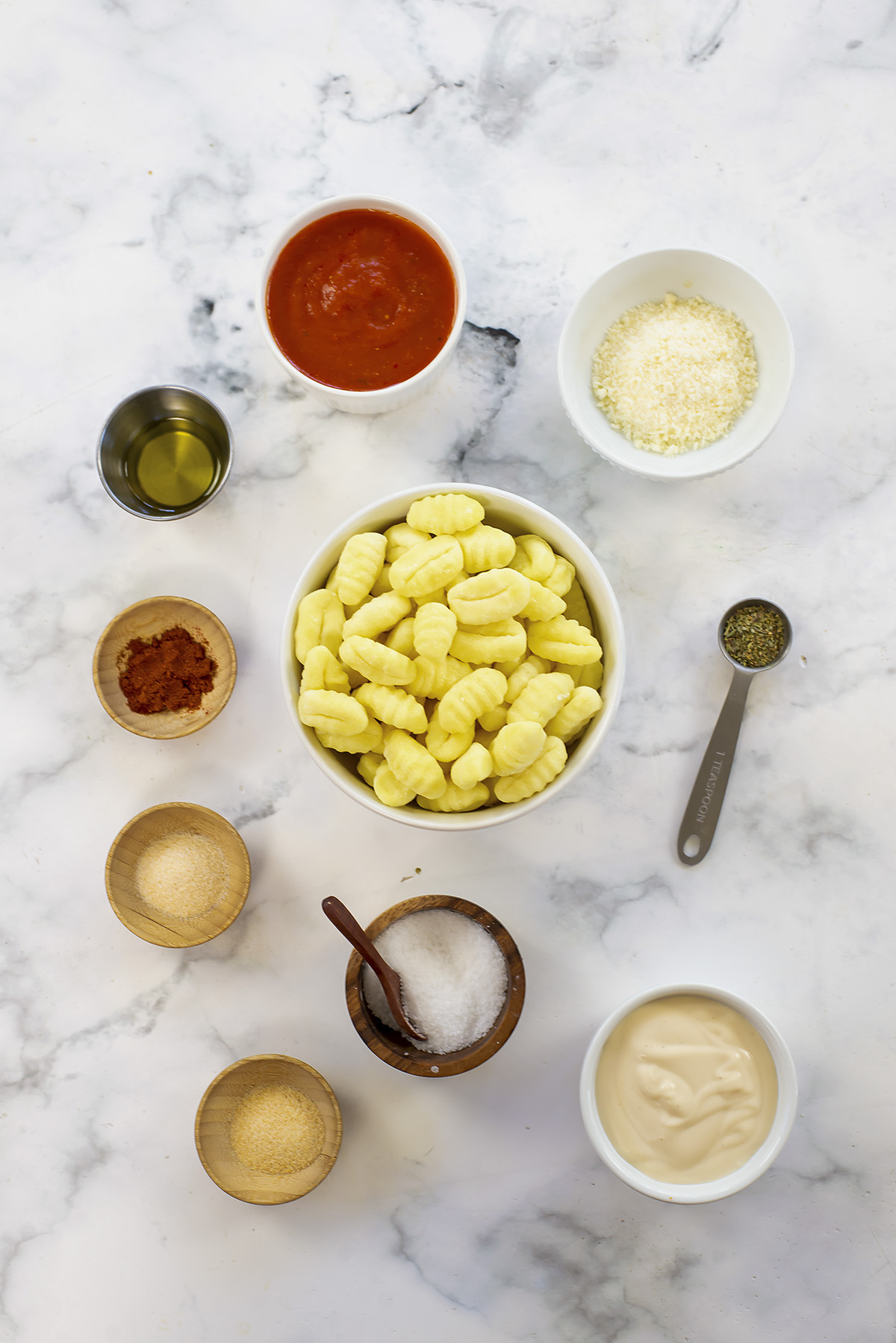 Ingredients for air fryer gnocchi on a countertop.