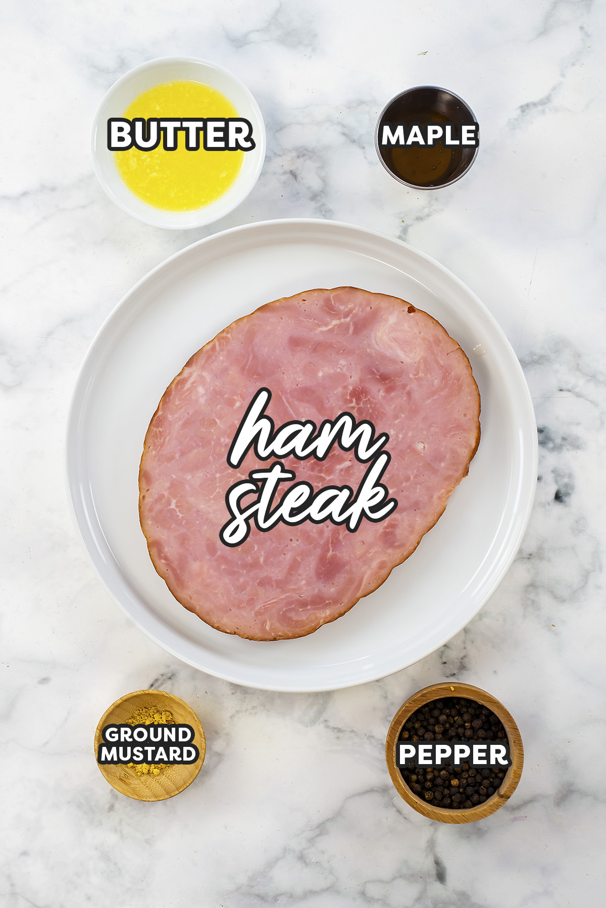 Ham steak ingredients on a white countertop.