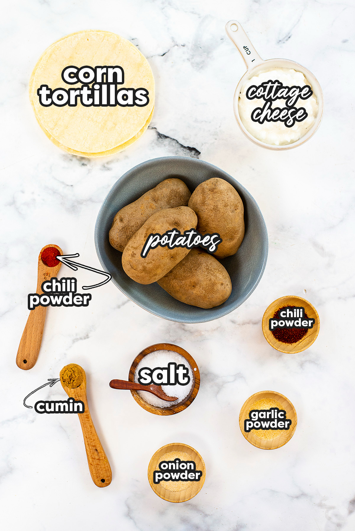 Ingredients for potato tacos spread out on a counter.
