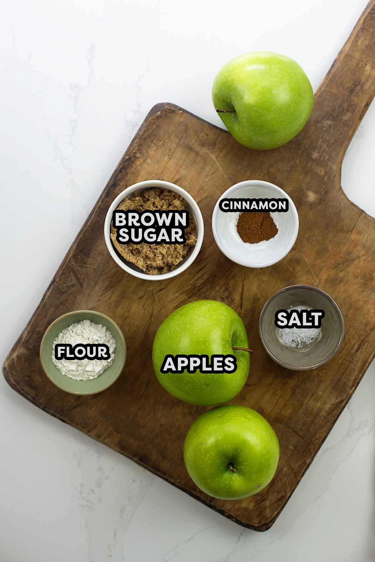 Air fried apple crisp ingredients on a cutting board.