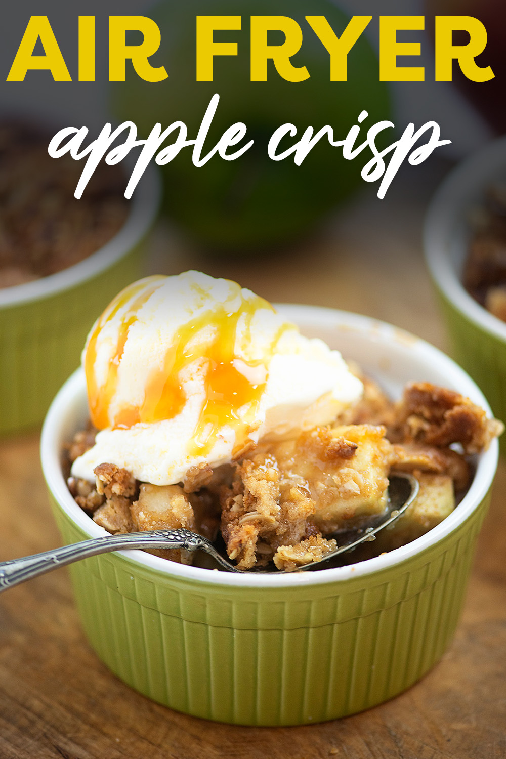 Close up of apple crisp topped with ice cream in a small round dish.