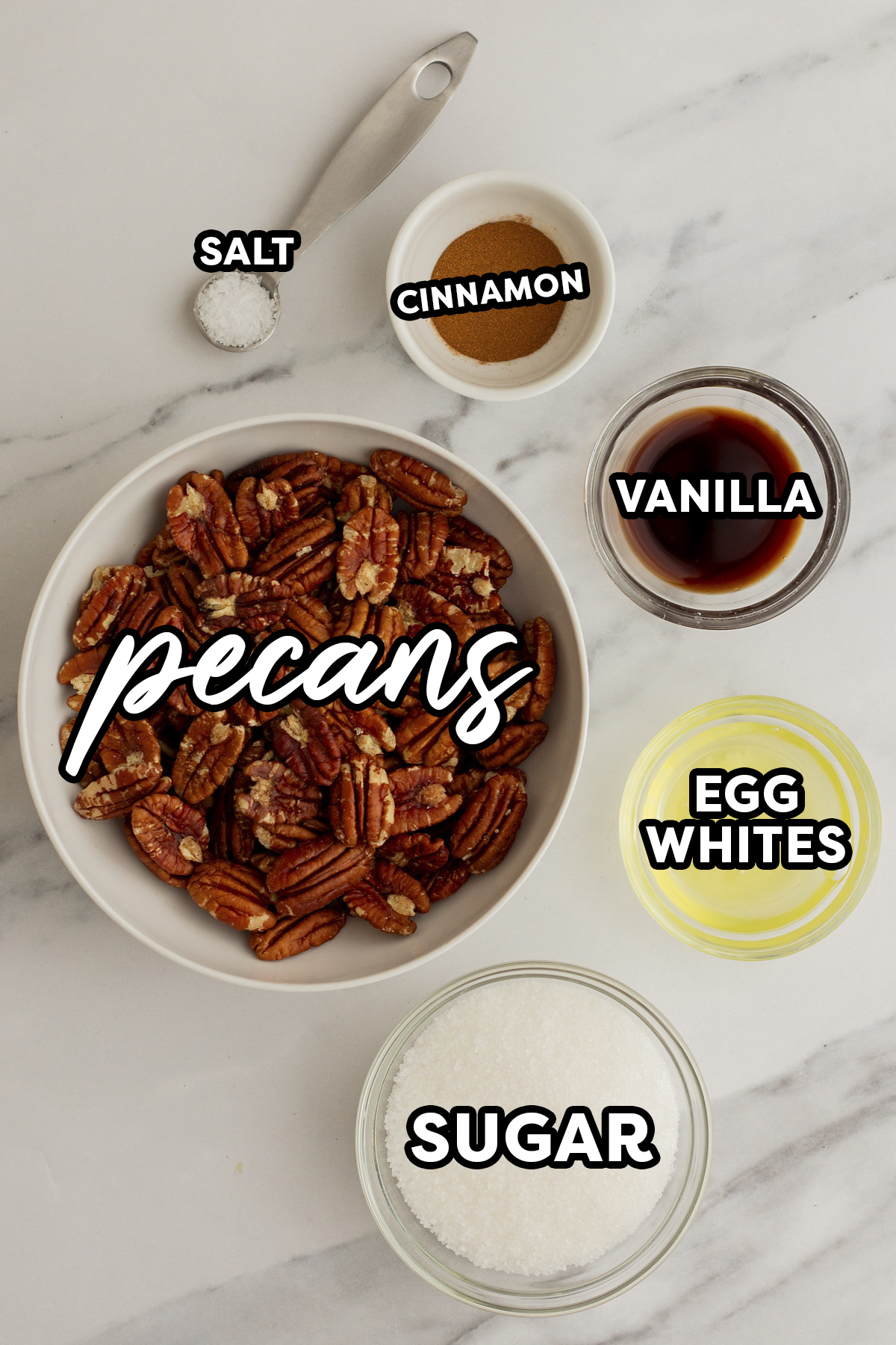 Ingredients for candied pecans on a white countertop.