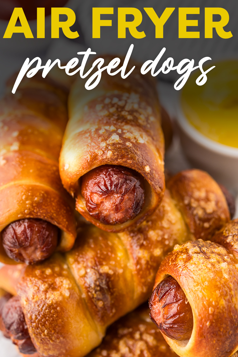 We used our air fryer to get the perfect pretzel dog!  The fluffy, crips pretzel hugs the hot dog while the air fryer cooks them all.  AMAZING!
