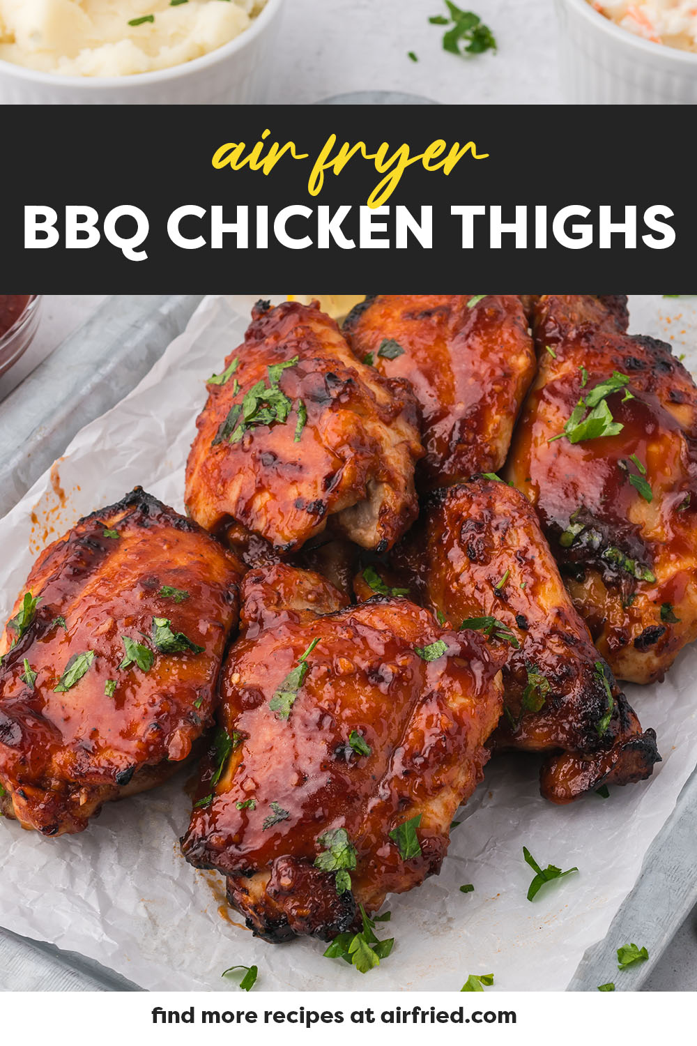 Several BBQ chicken thighs on a baking sheet.