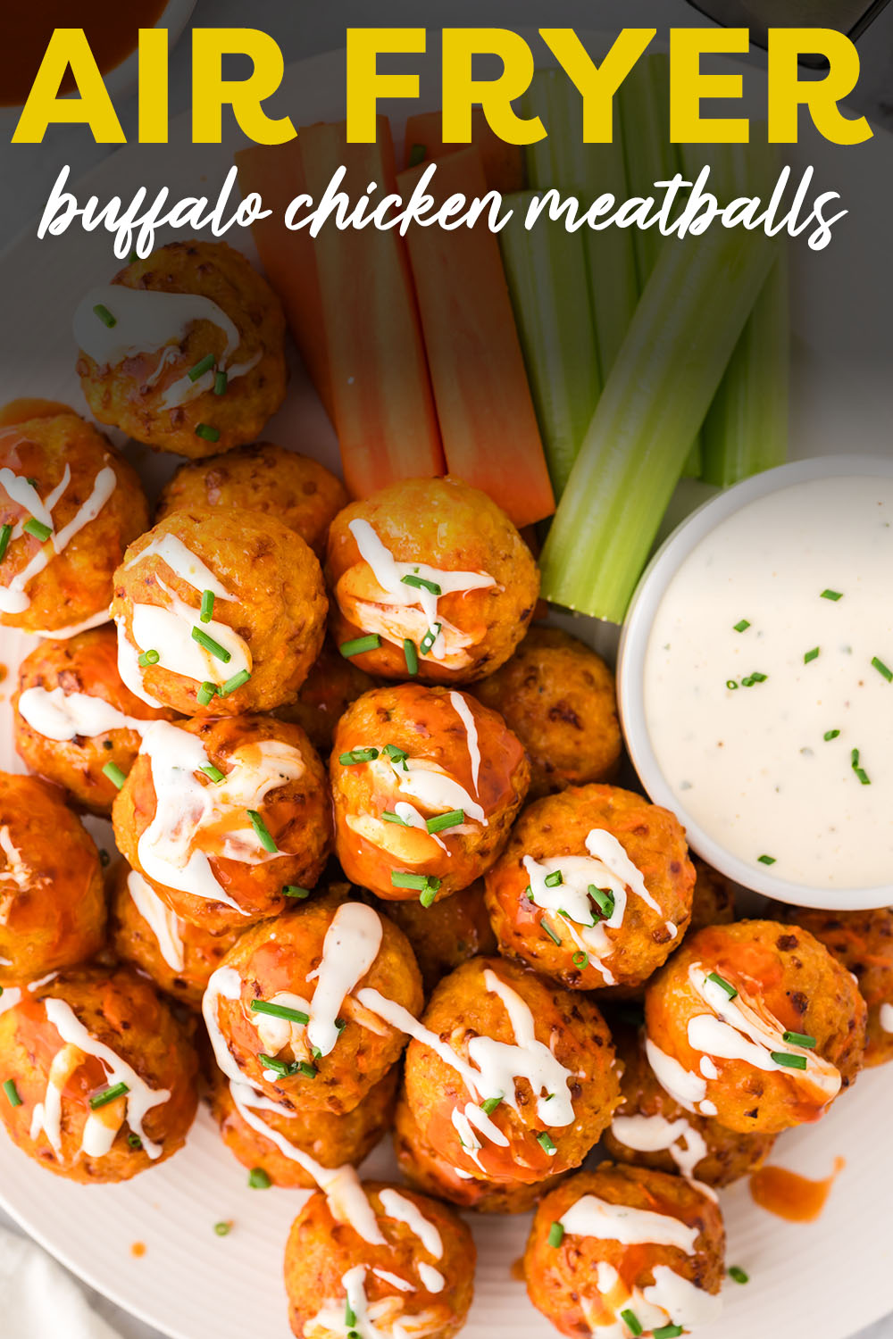 Buffalo chicken meatballs stacked up on top of each other on a plate.