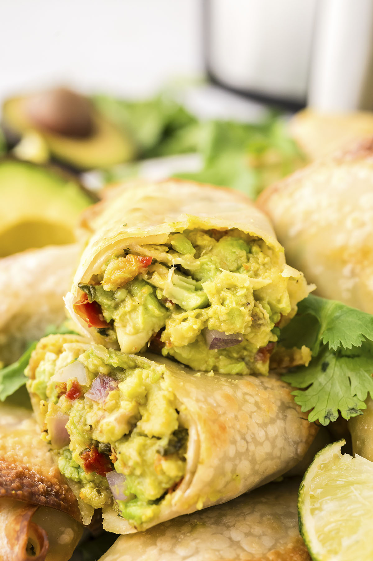 Close up of an avocado egg roll split in half.