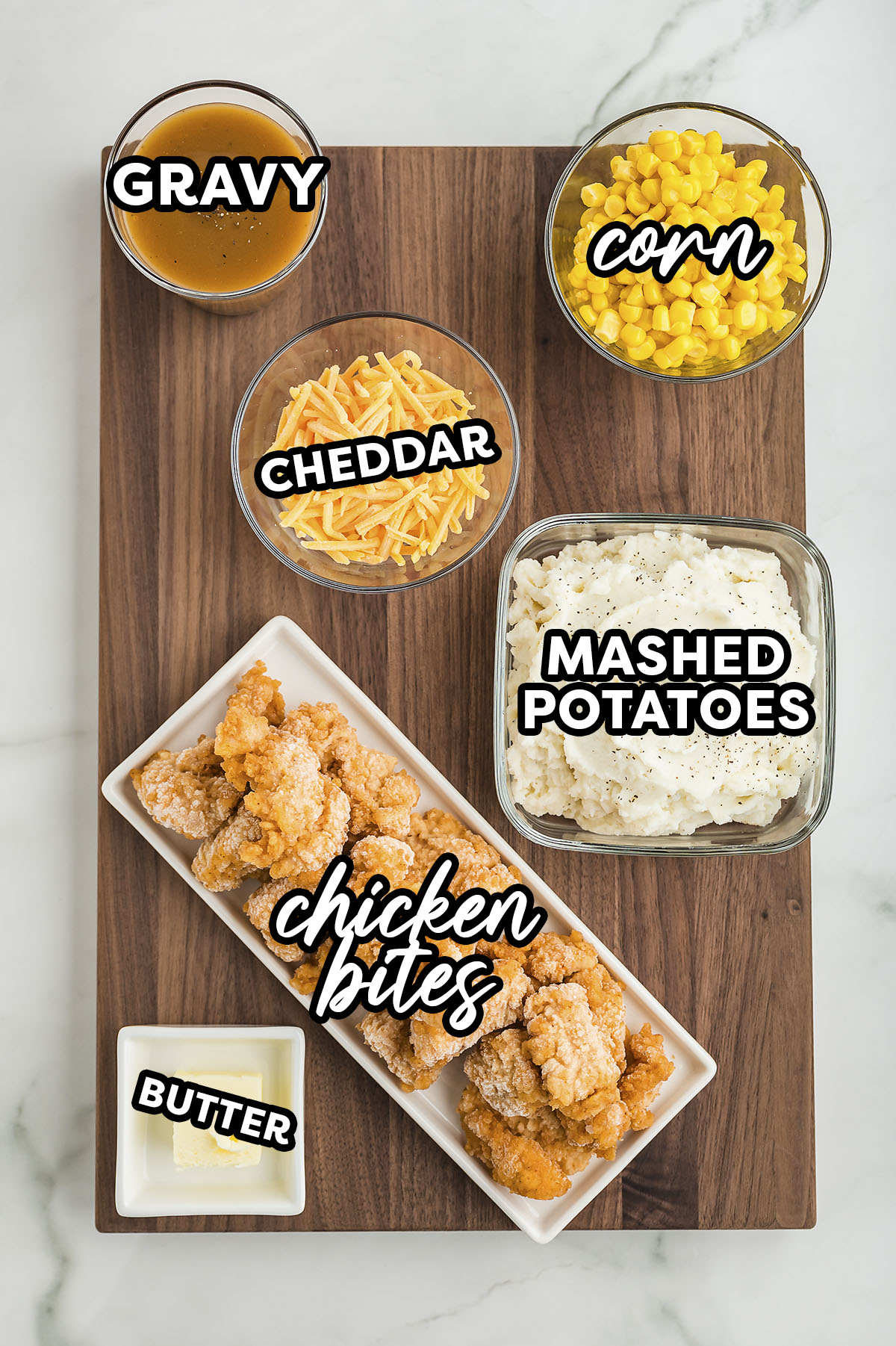 Ingredients for homemade KFC bowls on a cutting board.