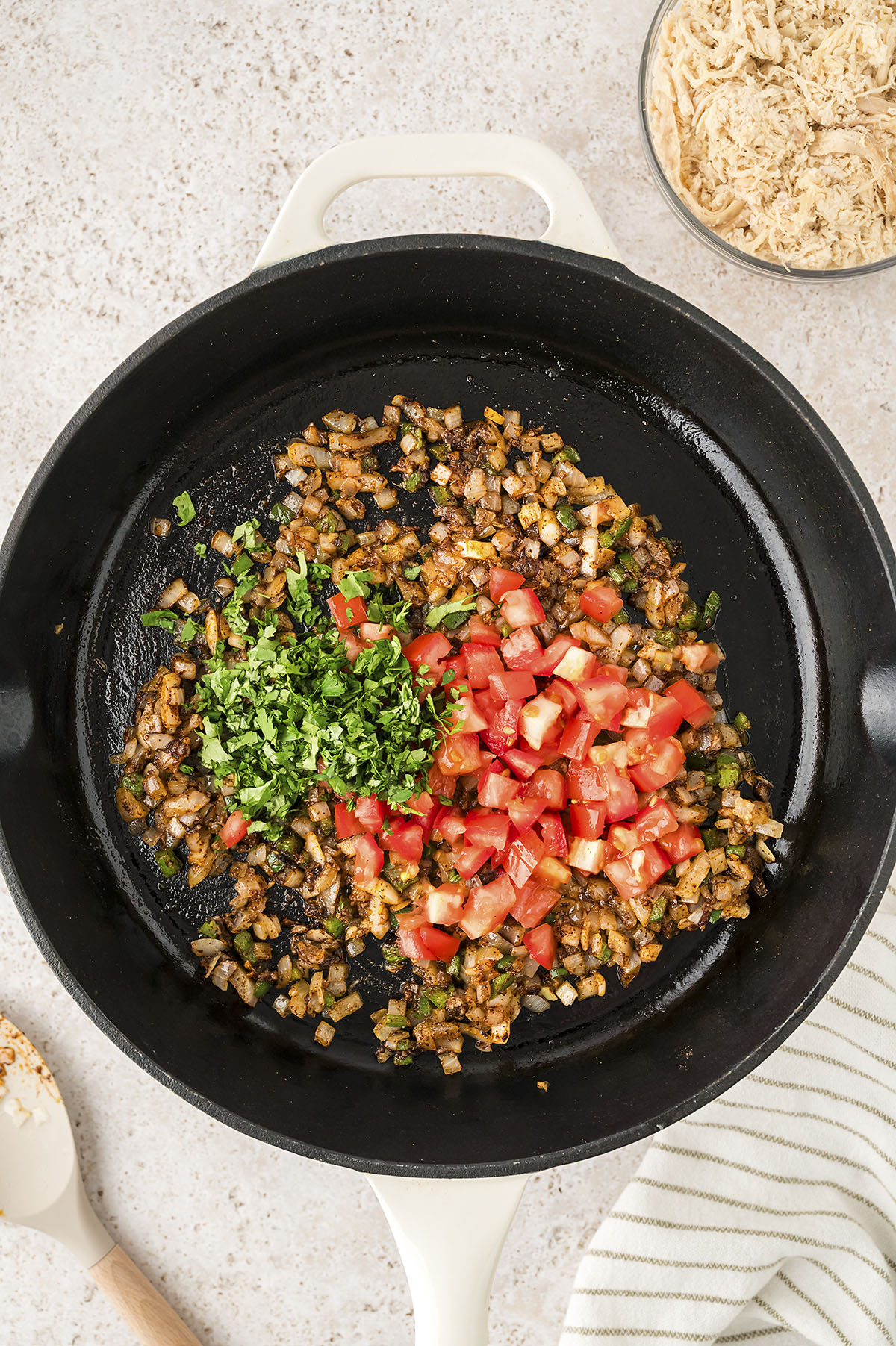 Vegetables cooking in skillet.