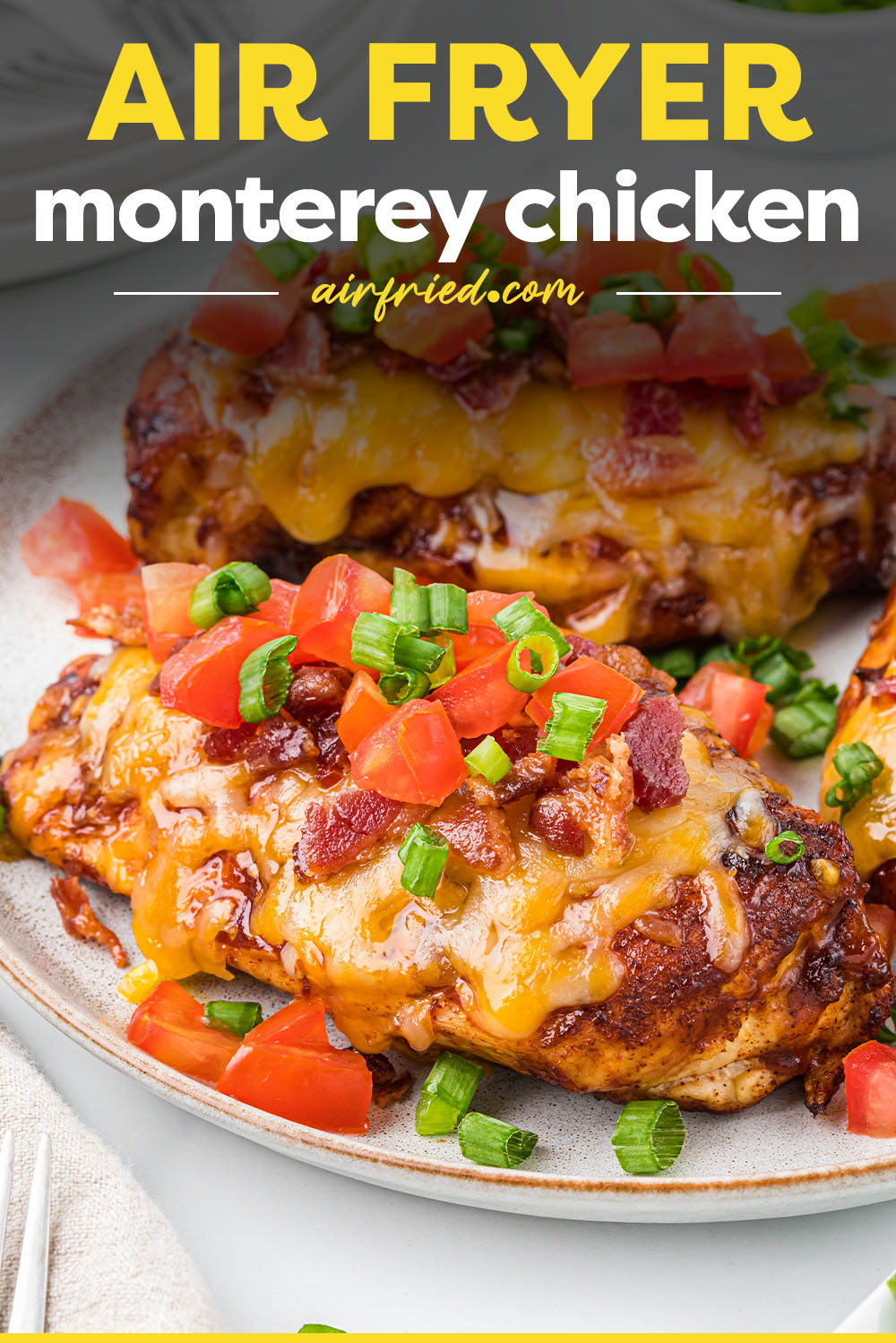 Air Fryer Monterey Chicken is an easy homemade copycat version of a Chili's classic. This cheesy, saucy, tender and juicy chicken is topped with your favorite BBQ sauce, Colby Jack cheese, bacon, diced tomato and green onion - all cooked in the air fryer in just 15 minutes!