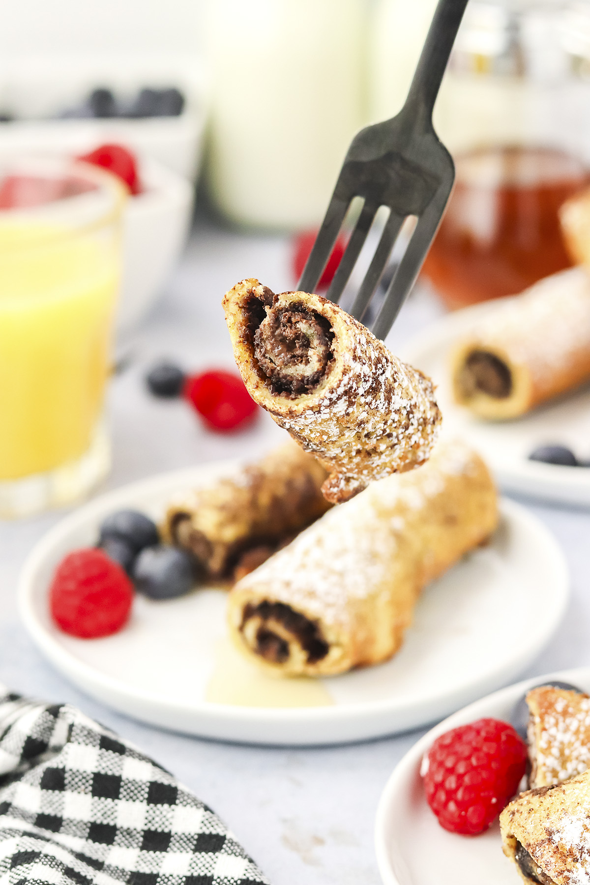 French toast roll up on fork.