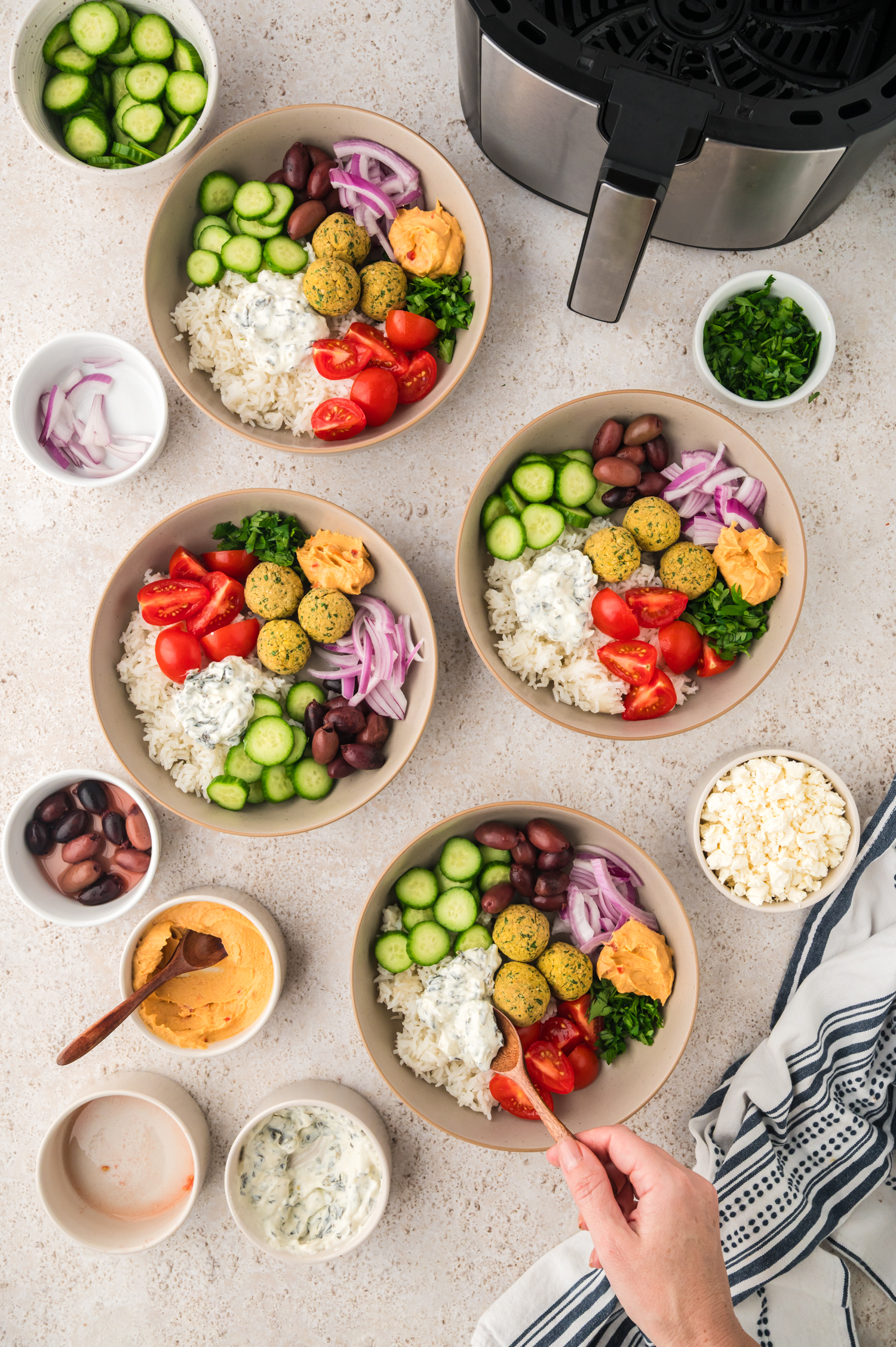 Falafel bowls being built.