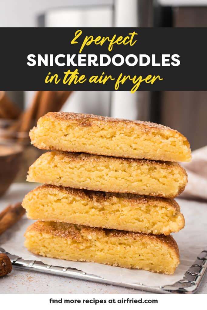 Two snickerdoodle cookies have been halved, and the pieces are stacked in pairs, forming two small towers of cookie halves.