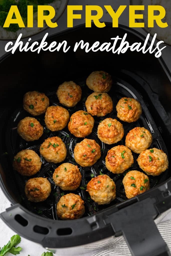 5 rows of cooked chicken meatballs in an air fryer basket.