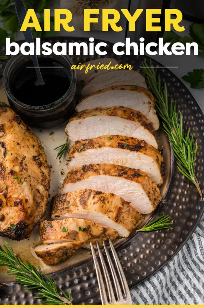 Balsamic chicken is sliced and arranged on a plate, showing the interior of the cooked pieces.