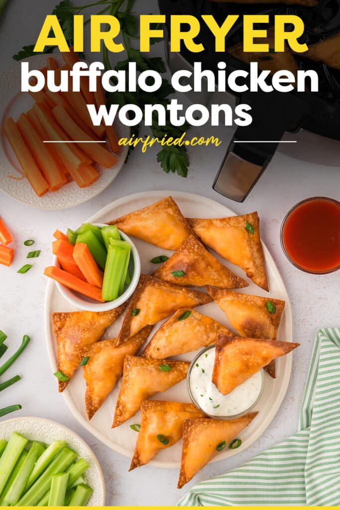Buffalo chicken wontons are arranged in a single layer on a white plate.