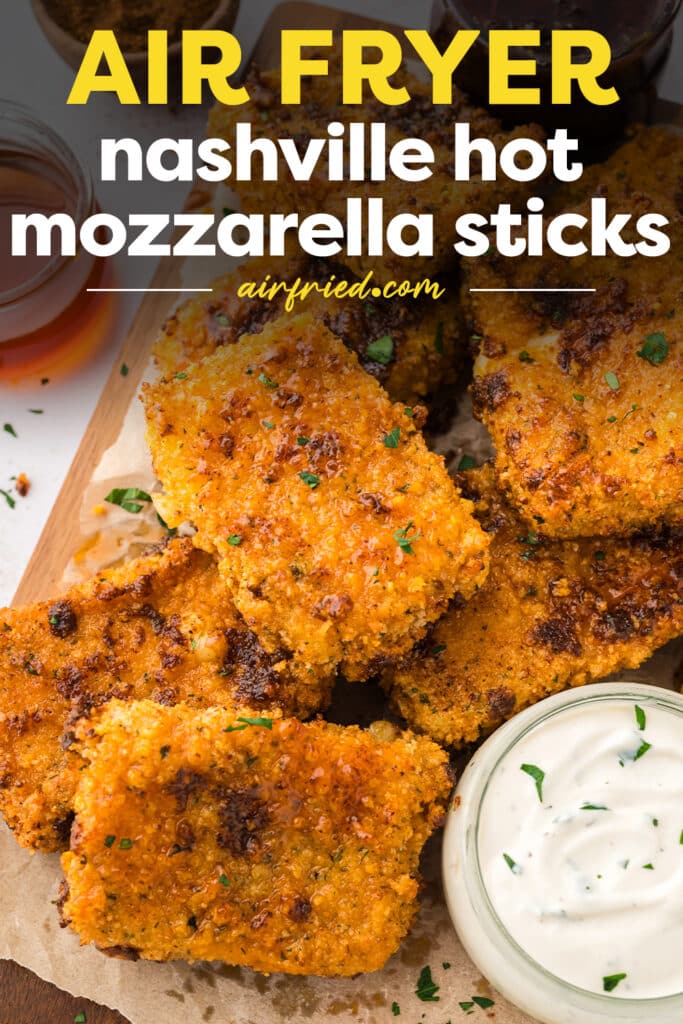A close-up of Nashville hot mozzarella sticks coated in a deep red spicy seasoning, with a text overlay labeling them.