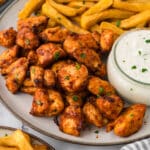 Close up of chicken bites on a plate.
