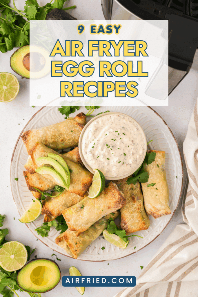 Plate full of egg rolls with dipping sauce.
