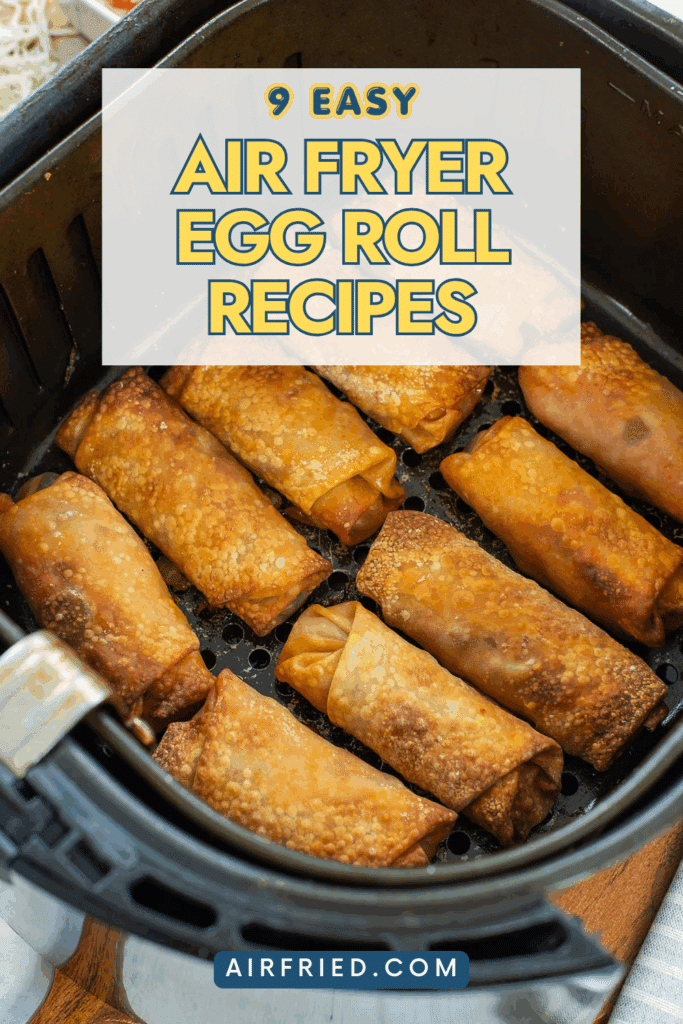 Egg rolls in air fryer basket.