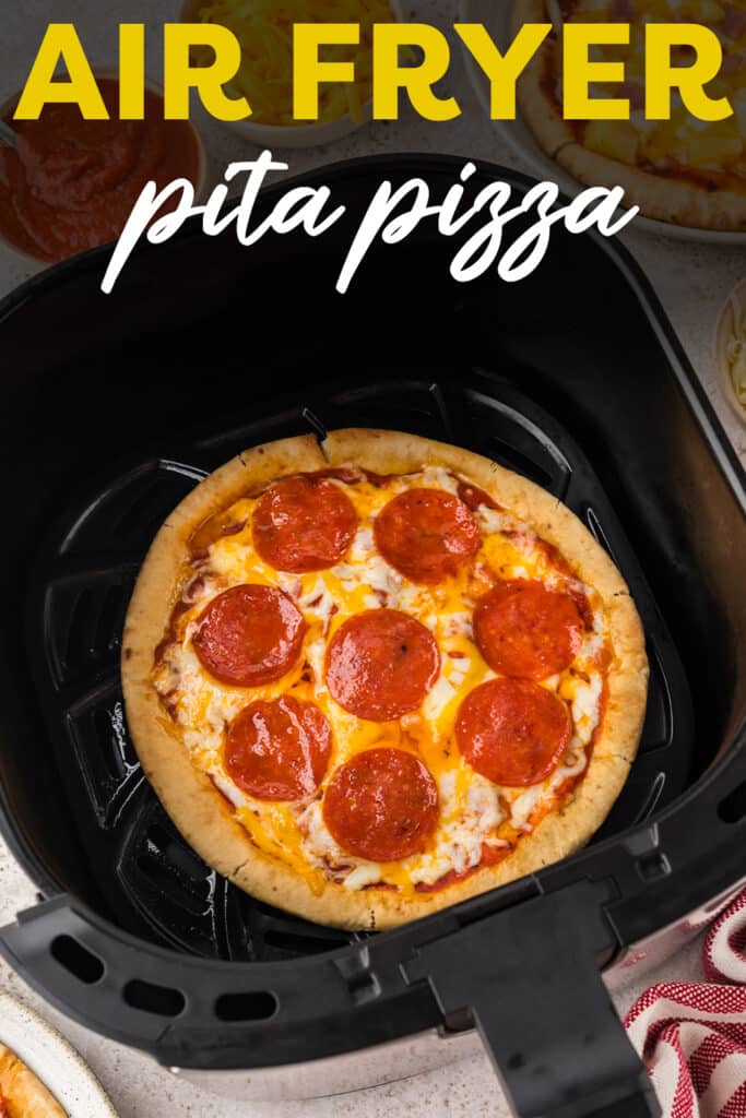 Pita Pizza inside an air fryer basket.