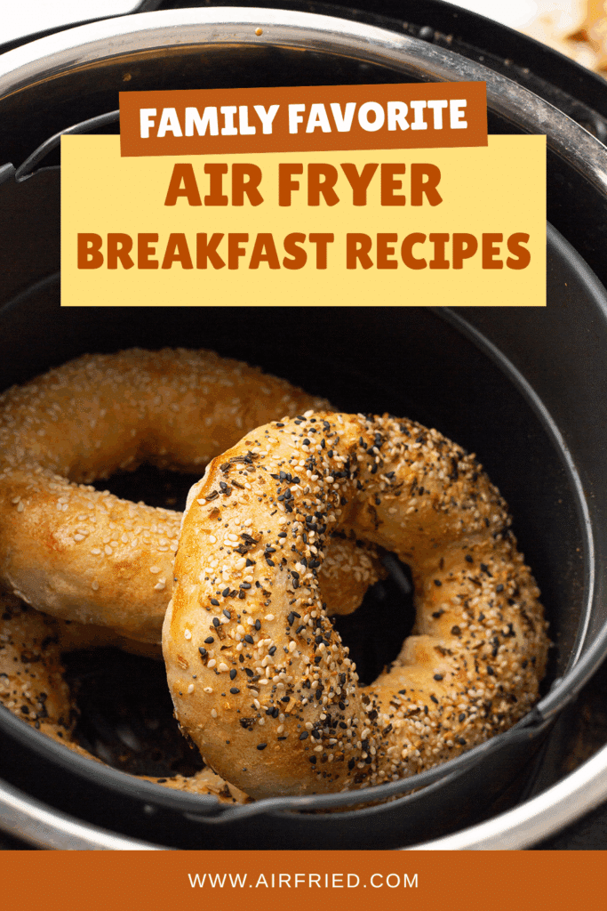 Bagels in an air fryer basket.
