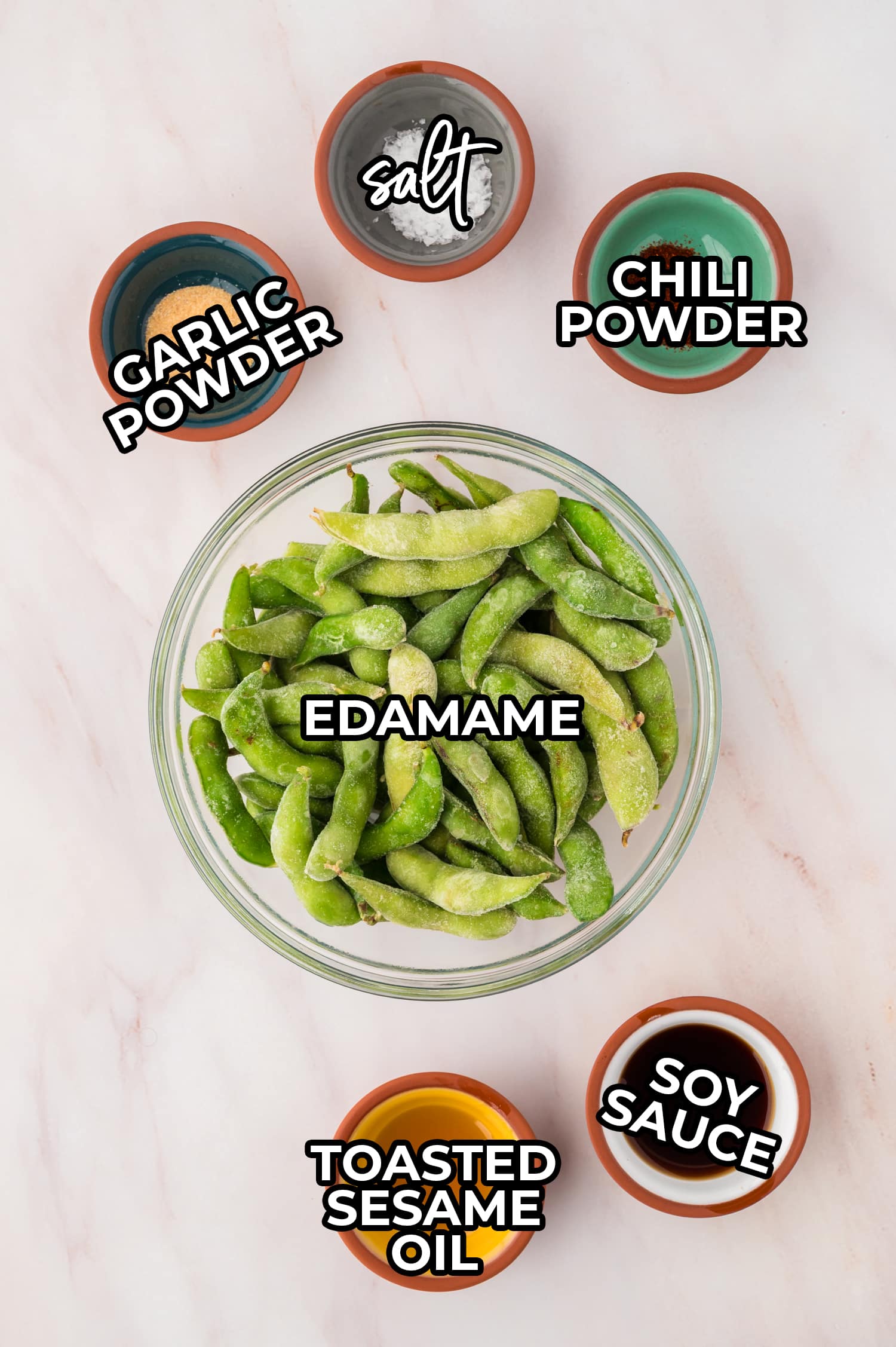 Ingredients for cooking edamame in small bowls with a text overlay.