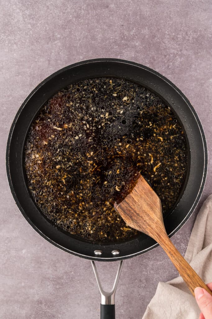Mongolian chicken sauce cooked in a skillet.