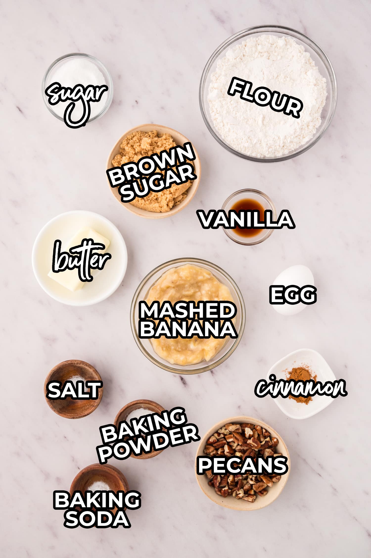 Ingredients for air fryer banana bread spread on a white countertop with a text overlay.