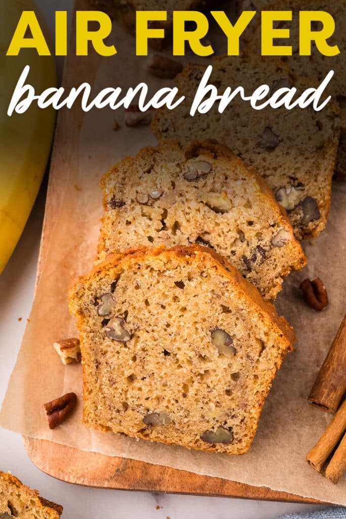 Close up of sliced air fryer banana bread with pecan bits around it.